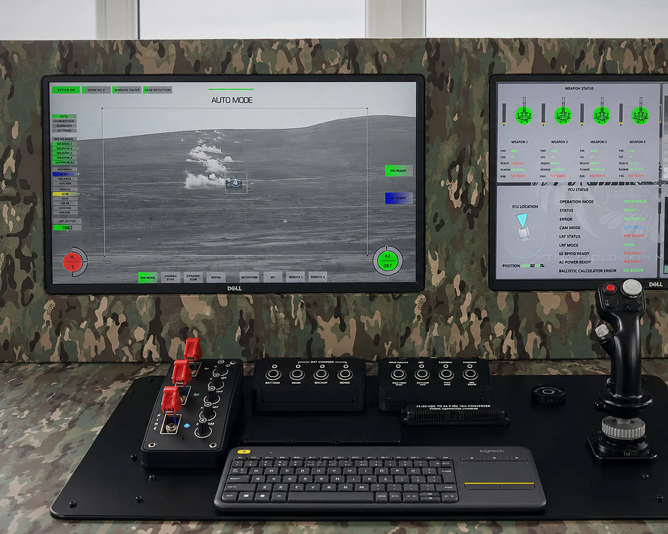 Operator console with joystick and displays showing the integrated control interface